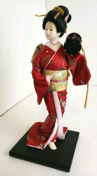 Vtg Porcelain Geisha Girl Doll W/red Satin Kimono,  Drum,  Black Wood Stand - 13 " H
