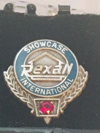 Vintage Rexall Showcase International Lapel Pin Sterling Silver W/ Red Stone