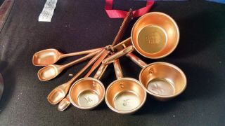 Vintage Set Of Copper Colored Aluminum Measuring Cups,  Spoons,  Wall Hangers