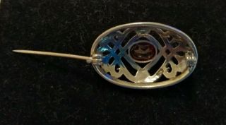 Vintage sterling silver Celtic shield brooch with garnet centre 2