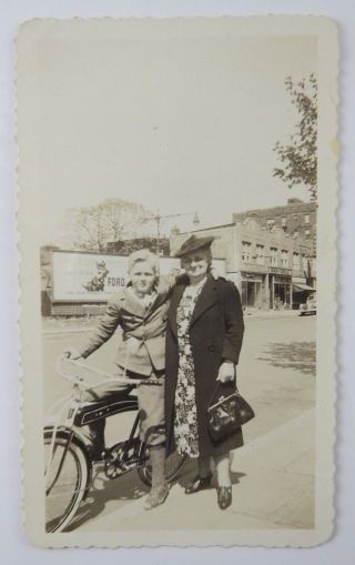 Vintage Snapshot Photograph Woman Standing With Boy On Bicycle Ford Billboard