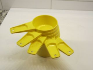 Set Of 5 Vintage Yellow Tupperware Measuring Cups in 3