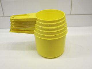 Set Of 5 Vintage Yellow Tupperware Measuring Cups in 4