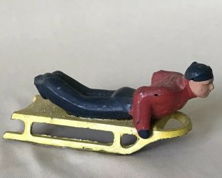 3” Vintage Barclay Lead Figure Man On Yellow Sled