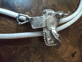 Vintage Bolo Tie With Silver Colored Saddle Concho.