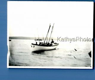 Found Vintage Photo A_0242 View Of People In Boat Holding Aors Up