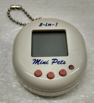 Vintage 1997 White 8 - In - 1 Electronic Mini Virtual Pet Keychain Toy -