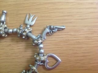 An Unusual Vintage Silver - Toned Charm Bracelet with 10 unusual Charms 2