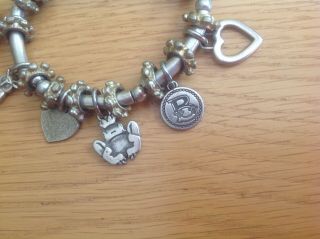 An Unusual Vintage Silver - Toned Charm Bracelet with 10 unusual Charms 4