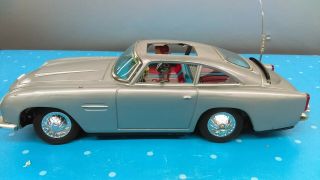 1965 Gilbert James Bond 007 Aston Martin Tin Battery Operated Car Parts Repair A