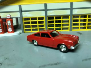 1/64 76 Chevy Vega Fastback/red/blk Int/4 Cyl.  Auto/rubber Tires/stock Hubcaps