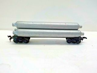 Lionel Ho Scale Model Train Skeleton Flat Car With Silver Tube Load