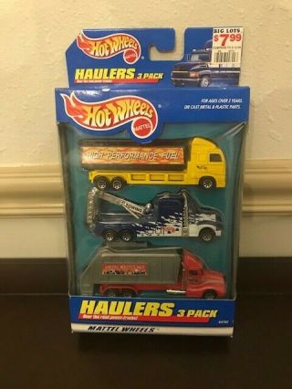 Hot Wheels Haulers 3 - Pack 65762 Huge Trucks Yellow,  Blue,  And Red
