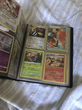 A Full Binder Of Holographic Pokemon Cards