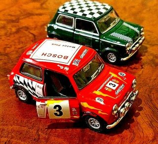 Two Classic Mini Cooper 1/43 Scale Diecast Cars.