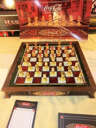 The Franklin Coca Cola Stained Glass Chess Board Set.