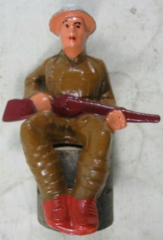 Vintage Manoil Barclay Soldier Sitting On A Stump With Rifle In Lap