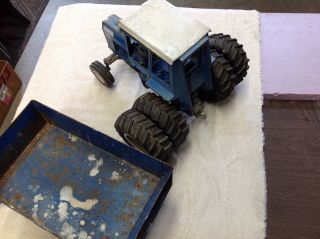 Ford 8600 toy tractor with cab,  duals,  and big blue wagon played w/ 3