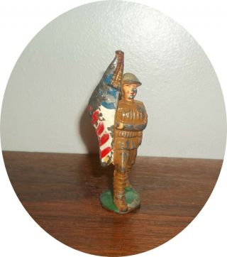 Neat Soldier Marching With Flag Cast Helmet Manoil