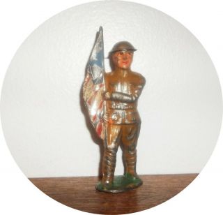 Neat Soldier Marching With Flag Short Stride Tin Helmet Barclay / Manoil
