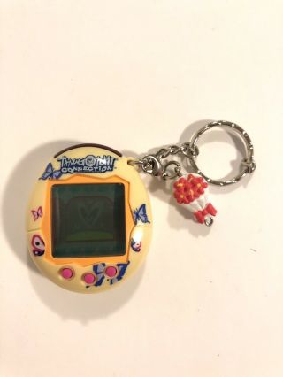 Tamagotchi Connection V2 Yellow Butterfly 2004 Shell With Charm