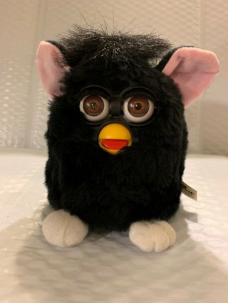 Black Furby With Brown Eyes And Pink Ears