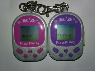 | 2 Nano Pets Puppy Family | Playmates| Virtual Dog | 1998 | Giga | Tamagotchi |