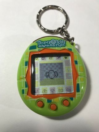 2004 Tamagotchi Connection Bandai Green Orange Virtual Digital Pet Keychain