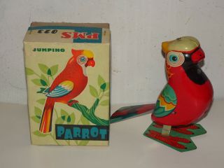 Red China Parrot Merry Go Round Vintage Tin Toy