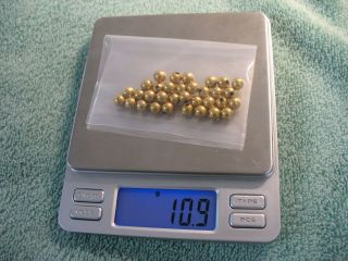14kt Solid Yellow Gold Scrap Beads Total Weight 10.  9 Grams.  Bag Weighs 1 Gram