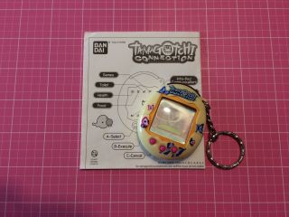 Tamagotchi Connection V2 (yellow,  Butterfly Shell,  Instructions)