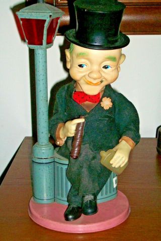 Vintage 1950s Battery Operated Tin Toy Top Hat Man Sitting On Dust Bin Lamp Post