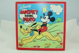 Disney Wind - Up Mickey Riding Pluto Toy By Schylling