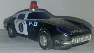 Vintage Tin Ferrari Highway Patrol Police Car Bump ‘n Go Battery Operated