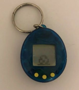 1997 Bandai Tamagotchi - Teal Blue / Yellow Buttons Open -