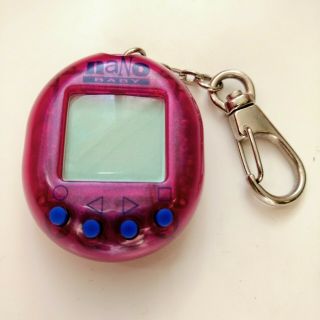 Nano Baby Virtual Pet Game Purple Playmates Toys 1997 Not