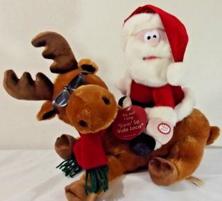 Dandee Santa Riding Reindeer Animated Plush Reindeer Sings " Livin La Vida Loca "