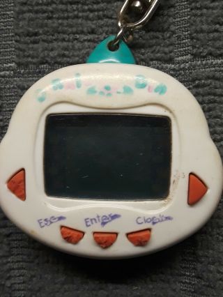 Giga Pet Compu Kitty Vintage 1997 and another game.  NOT.  Chain. 3