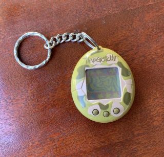 Vintage 1997 Tamagotchi Virtual Pet Game Keychain Green Camo