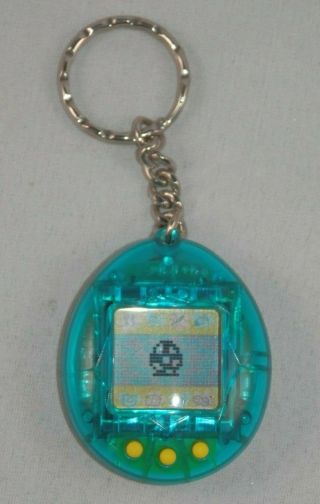 1997 Bandai Tamagotchi Clear Blue W/ Yellow Buttons Virtual Pet