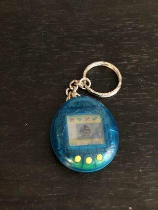 1997 Bandai Tamagotchi Teal Blue With Yellow Buttons Open