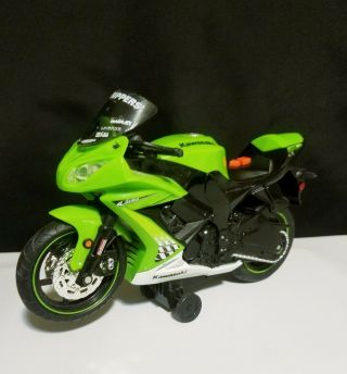 Kawasaki Ninja Zx - 10 Wheelie Bike,  Lights Up Engine Sounds & Vocal Phrases