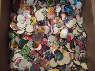 200 Miscellaneous Pogs,  4 Slammers,  3 Playboards,  1 6 Inch Tube Milk Caps