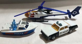 Matchbox 52 Police Launch Boat,  10 Plymouth Police Car,  Majorette Helicopter