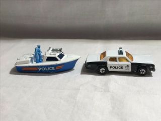 MATCHBOX 52 POLICE LAUNCH BOAT,  10 PLYMOUTH POLICE CAR,  MAJORETTE HELICOPTER 3