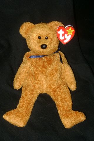 Ty Beanie Baby " Fuzz " Teddy Bear,  Brown With Blue Bow