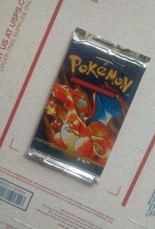 Weighed Heavy Pokemon 1st Edition Base Set Booster Pack - Charizard - Spanish