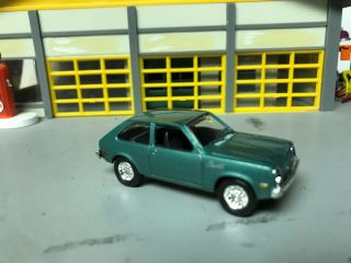 1/64 1978 Chevy Chevette/met.  Green/blk Int/4cyl.  Auto/rubber Tires/stock Hubcap