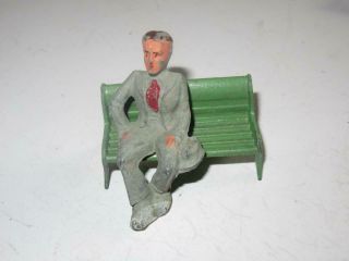 Lead Sitting Male Figure On A Metal Bench - Approx 2 1/2 " - Good - W18